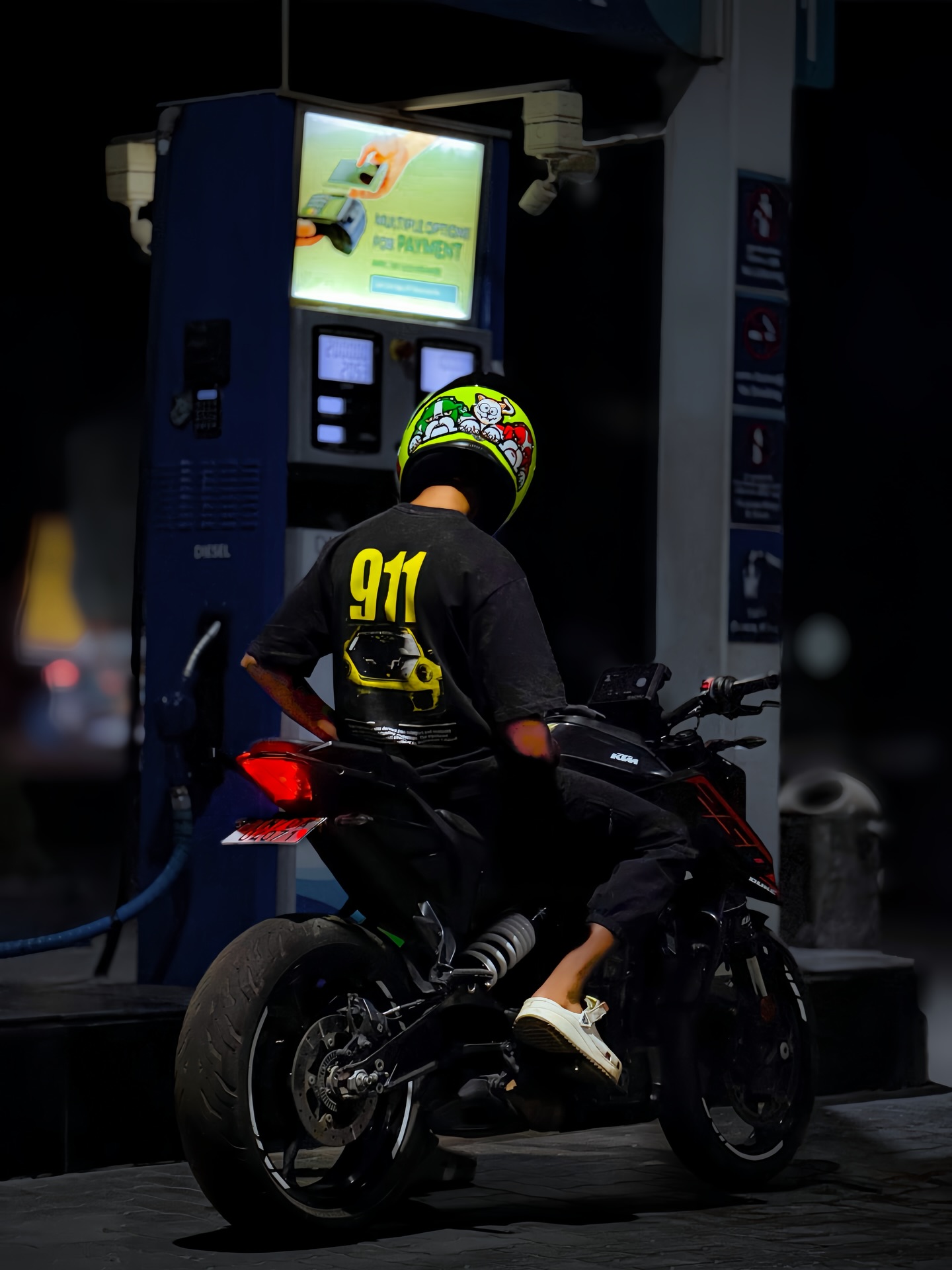 KTM Duke at a fuel station at night